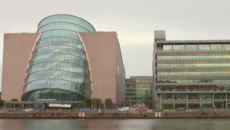 Dublin's-Convention-Centre-on-riverfront-at-dusk,-modern-architecture,-urban-skyline