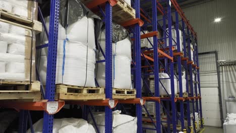 Inside-a-warehouse:-many-shelves-laden-with-neatly-stacked-pallets