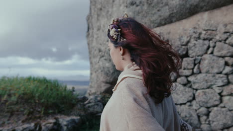 spiritual-woman-looking-at-the-horizon-in-a-medieval-village