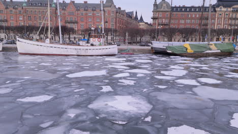 Aerial-view-over-frozen-water-of-Strandvägen-on-Östermalm-in-central-Stockholm