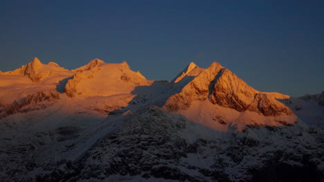 Wide-Shot-of-Mountain-Range-Covered-By-Snow-At-Sunrise,-Swiss-Alps-In-Aletsch-Glacier-Area