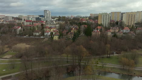 Park-with-path-and-river-in-polish-residential-area-with-blocks-in-Poland