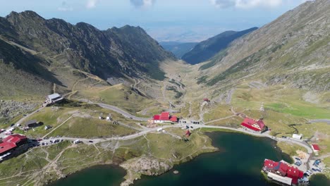 Transfaragasan-Mountain-Road-Pass-and-Lake-Balea-in-Carpathians,-Transylvania,-Romania---Aerial-4k