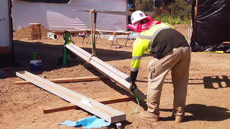 Gimbal-shot-of-an-industrial-fork-lift-moving-pre-fabricated-steel-beams-a-modular-construction-site-in-West-Los-Angeles,-California