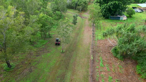 Aerial-drone-of-Buggy-Driving-on-Residential-Property-in-a-Rural-Estate-Covered-with-Sparse-Outback-Forest