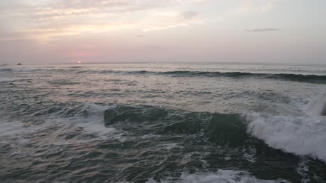 Ocean-waves-with-setting-sun-over-sea