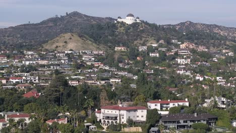 Drone-Shot-of-Griffith-Observatory-Building-and-Residential-Neighborhood-of-Los-Angeles