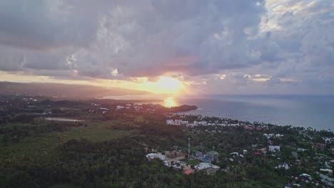 Aerial-Panoramic-View-over-Las-Terrenas-at-Cloudy-Sunset,-Dominican-Republic
