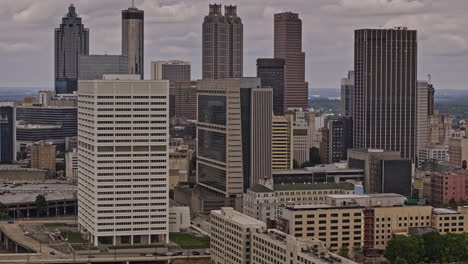 Atlanta-Georgia-Aerial-v919-zoomed-drone-flyover-south-downtown,-capturing-cityscape-with-high-rise-buildings-lining-the-skyline-of-central-business-district---Shot-with-Mavic-3-Pro-Cine---May-2023