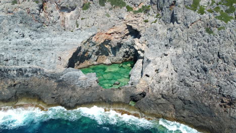 Aerial-view-of-Green-Lake,-a-natural-sea-pool-in-Kithira,-Greece