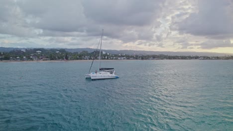 Orbit-View-of-Catamaran-in-Turquoise-Tropical-Waters-of-Las-Terrenas