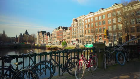 Geldersekade-canal-houses-in-sunlight-next-to-water-heart-of-Amsterdam-City-centre