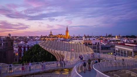 Setas-de-Sevilla-Timelapse-with-Tourists-and-Scenic-Cityscape-During-Purple-Skies-Overhead