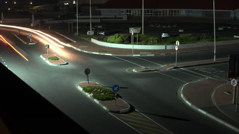 A-fast-paced-Night-time-long-exposure-Timelapse-of-Cars-passing-through-a-busy-intersection-leaving-long-light-trails-behind-them