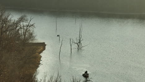 Fisherman-In-A-Boat-At-Lake-Swepco-In-Arkansas,-United-States