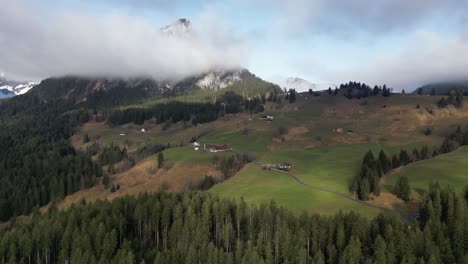 Obersee-Glarus-Näfels-Switzerland-backwards-flight-shows-homes-on-the-sunny-mountainside
