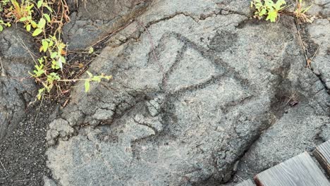 Human-stick-figure-carving-in-ancient-Hawaiian-lava-rock