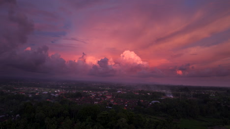 Vibrant-clouds-in-sky-over-Ubud-Bali-countryside,-aerial-view