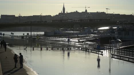 Carl-Lutz-Quay-and-the-Traffic-of-Margaret-Bridge-in-the-Background-in-Budapest,-Hungary-during-the-flooding-of-River-Danube---December-28,-2023