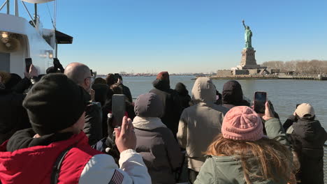 People-Take-Pictures-of-Statue-of-Liberty-from-Ferry