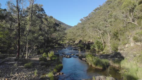 Aerial-shot-moving-forward-over-a-river-in-the-Victorian-high-country