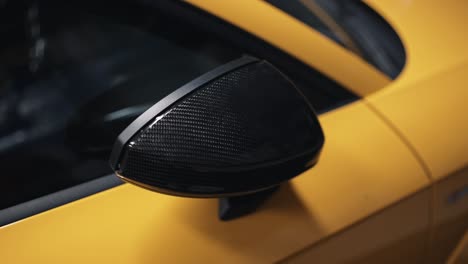 Expanding-Carbon-fiber-side-mirror-on-luxury-yellow-car