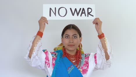 Cinematic-clip-of-a-young-brunette-latin-girl-wearing-the-traditional-outfit-named-Cayambeñas-showing-up-a-message-saying-"No-war