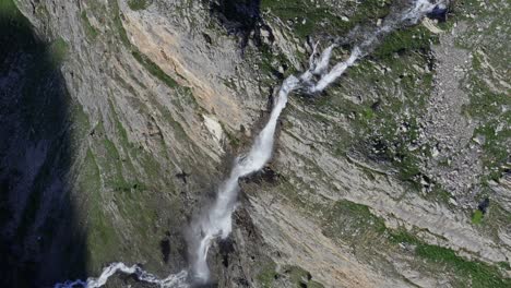 Cascata-di-stroppia-and-lago-niera,-water-rushing-down-rocky-terrain,-aerial-view