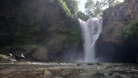 Surrounded-by-lush-greenery-and-rugged-rock,-Tegenungan-Waterfall