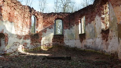 Abandoned-church-interior-wall-remains-with-arch-shape-wall-and-without-roof