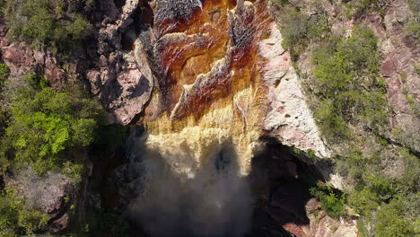 Aerial-view-of-a-waterfall-and-a-river-in-the-middle-of-a-big-vegetation,-Chapada-Diamantina,-Bahia,-Brazil