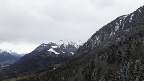 Aerial-4k-shot-of-beautiful-forest-and-winter-mountain-landscape