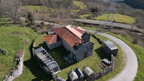 Right-to-left-aerial-overview-of-Church-of-Madanela-de-Cerdeira-in-San-Xoan-de-Rio,-Ourense,-Galicia,-Spain
