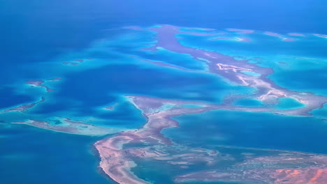 Aerial-tracking-shot-of-sandbanks-in-Ras-Mohammed-Nature-Reserve,-sunny-Egypt