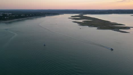 Panning-around-the-speeding-boats-on-Lake-Travis-at-sunset-in-Austin-Texas