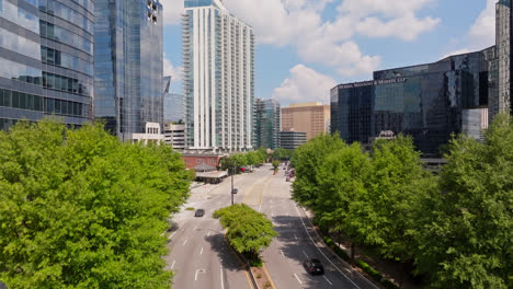 Rising-drone-shot-of-downtown-in-Buckhead,-Atlanta-during-sunny-day