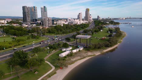 Aerial-views-over-the-Broadwater-Parklands-and-Gold-Coast-Highway-looking-North-on-a-sunny-day,-Australia