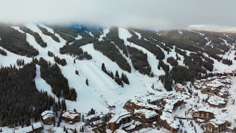 Fog-lift-cloud-layer-winter-snowy-early-morning-sunrise-aerial-drone-Copper-Mountain-Colorado-ski-resort-i70-Eagle-Flyer-lift-center-village-snowboarding-half-pipe-Ikon-Epic-pass-parking-lot-forward