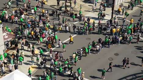 People-in-baseball-team-sportswear-supporting-Oakland-A-team-on-fan-fest