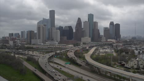 High-angle-drone-shot-of-downtown-Houston,-Texas-on-a-cloudy-day