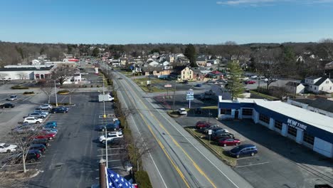 Rising-drone-wide-shot-of-american-flag-in-Lancaster-Town