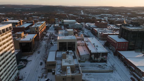 Flyover-Winter-Urban-Landscape-Of-Fayetteville,-Arkansas-At-Sunset
