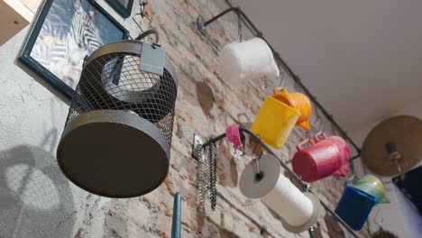 Hanging-candle-buckets-in-creative-workshop,-La-Candela-store-in-Venice