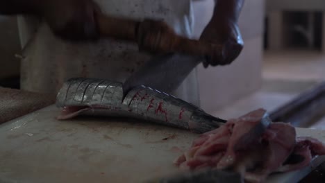 vendor-cutting-the-fresh-fish-close-up