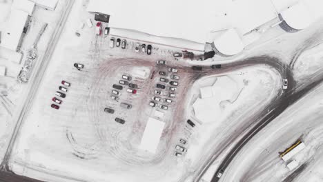 Aerial-View-Of-Alti-Kragero-Shopping-Mall-Parking-Lot-During-Winter-in-Sannidal,-Southern-Norway