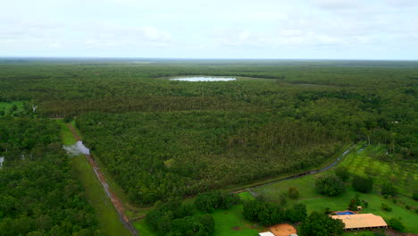 Aerial-drone-of-Vacant-Block-of-Rural-Estate-With-Stagnant-Billabong-Pool-In-Background,-Outback-Australia