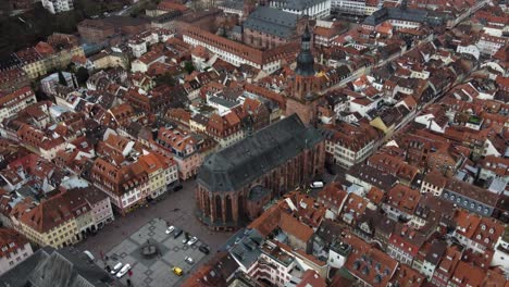 Aerial-View,-Church-of-the-Holy-Spirit-in-Heidelberg,-Germany,-Old-Town-Landmark-and-Buildings,-Drone-Shot