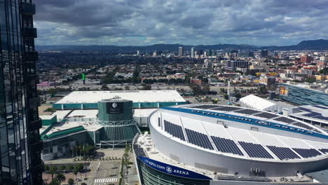 Aerial-view-passing-skyscrapers,-toward-the-Crypto