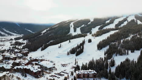 Sunny-foggy-cloud-layer-winter-snowy-early-morning-sunrise-aerial-drone-Copper-Mountain-Colorado-ski-resort-i70-Eagle-Flyer-lift-center-village-snowboarding-half-pipe-Ikon-Epic-pass-backwards