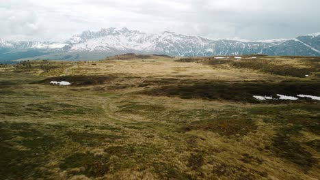 Smooth-Slow-Establishing-Drone-Shot-Of-Vast-Grasslands-In-SEISER-ALM---Early-Winter-Morning